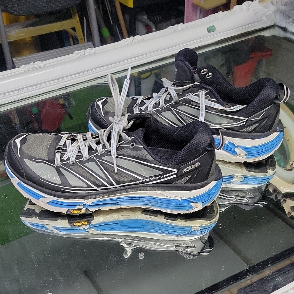 Mens 9.5 HOKA Mafate Speed 2 sneaker  black and white colorway  blue accents. 